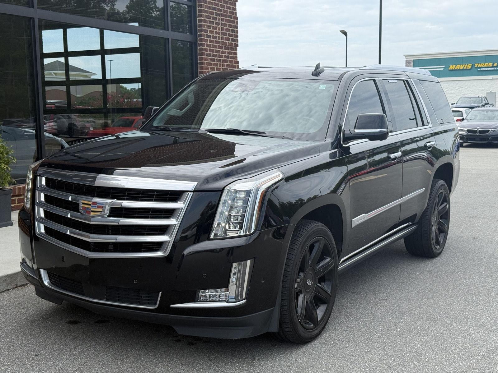 2020 Cadillac Escalade Premium Luxury in Black Raven — front three-quarter view