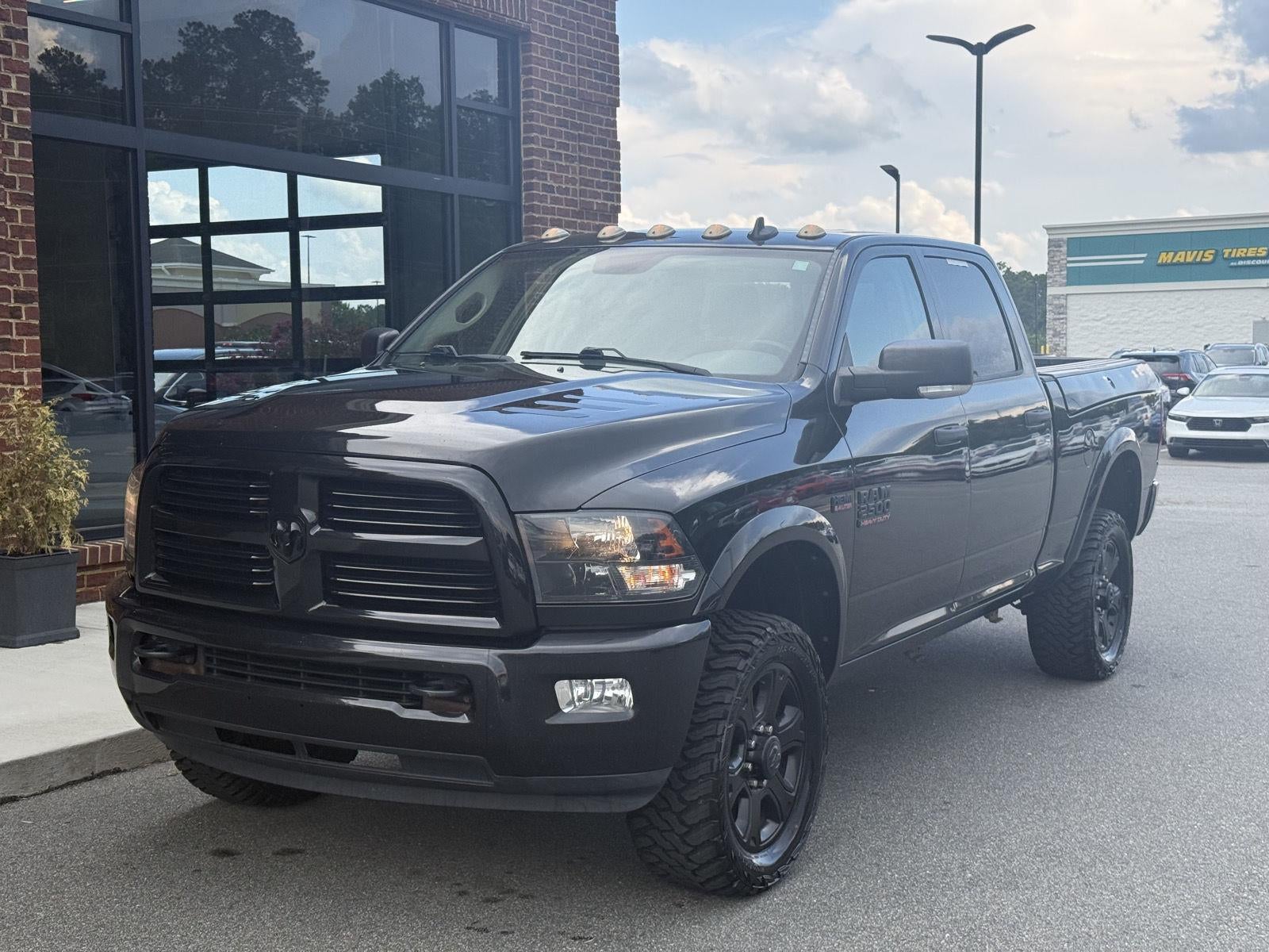 2017 RAM 2500 Big Horn in Brilliant Black Crystal Pearlcoat — front three-quarter view