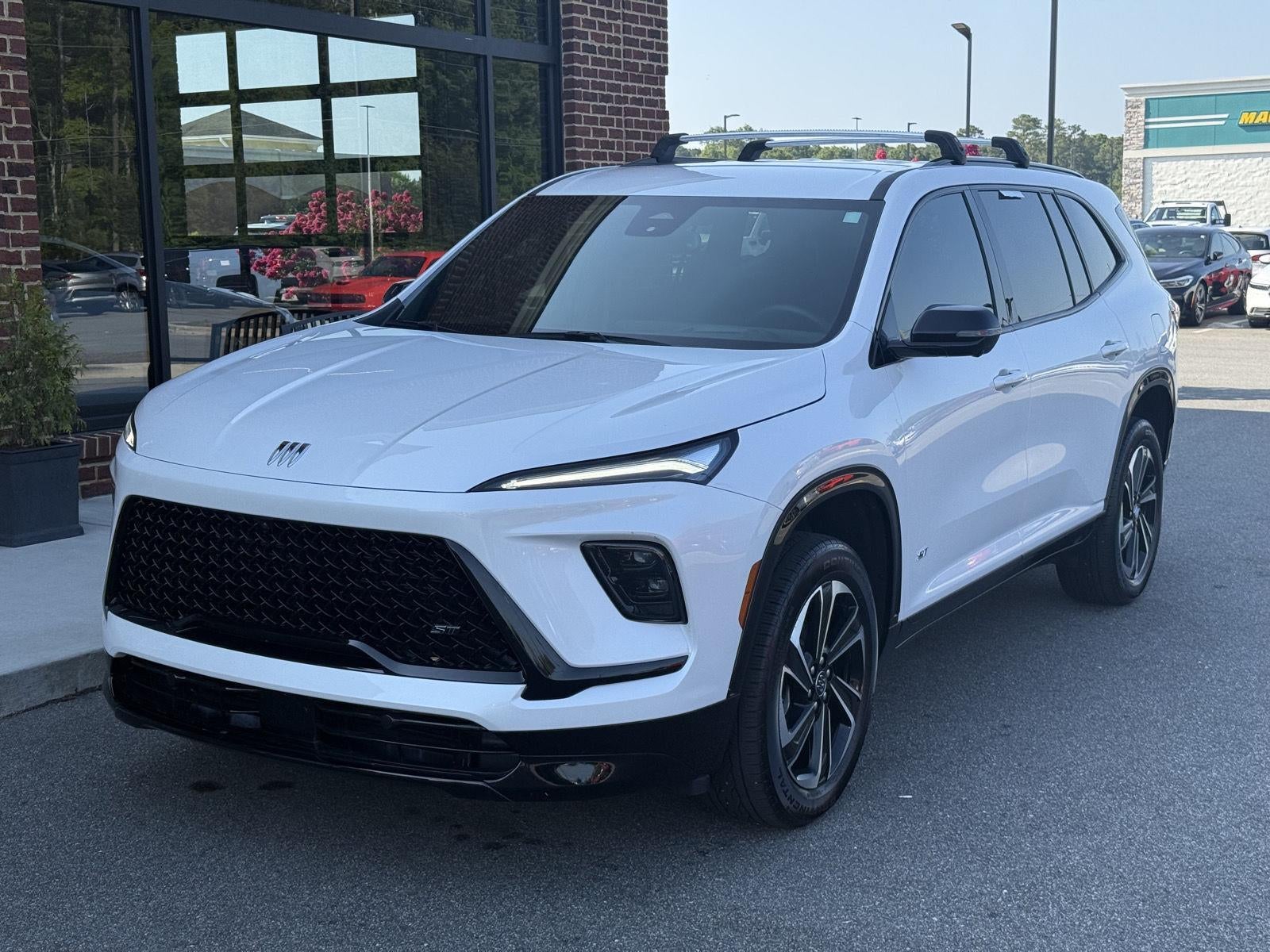 2025 Buick Enclave Sport Touring in White Frost Tricoat — front three-quarter view