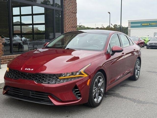 2022 Kia K5 EX in Passion Red Tintcoat — front three-quarter view