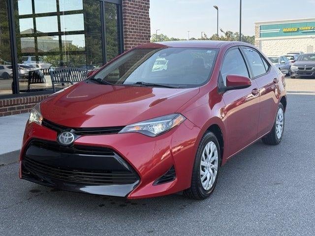 2018 Toyota Corolla LE in Barcelona Red Metallic — front three-quarter view